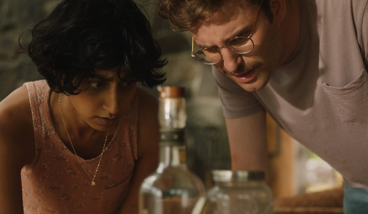 Sunita Mani (left) stars as Su and John Reynolds (right) stars as Jack in Alex H. Fischer & Eleanor Wilson’s Save Yourselves!, a Bleecker Street release Credit: Courtesy of Bleecker Street