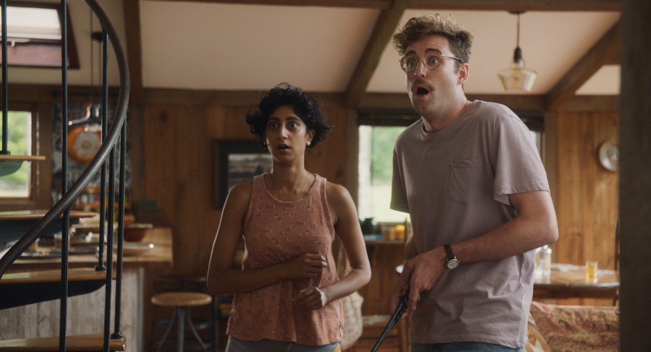 Sunita Mani (left) stars as Su and John Reynolds (right) stars as Jack in Alex H. Fischer and Eleanor Wilson’s Save Yourselves!, a Bleecker Street release. Credit: Courtesy of Bleecker Street