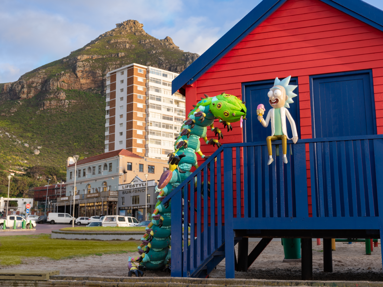 A sculpture of Rick and Morty character Tiny Rock at Muizenberg Beach Huts in Cape Town, South Africa. The scene is part of the ongoing #WORMAGEDDON fan experience leading to the global release of Adult Swim’s Rick and Morty season six starting September 4, 2022. (Courtesy Adult Swim) 