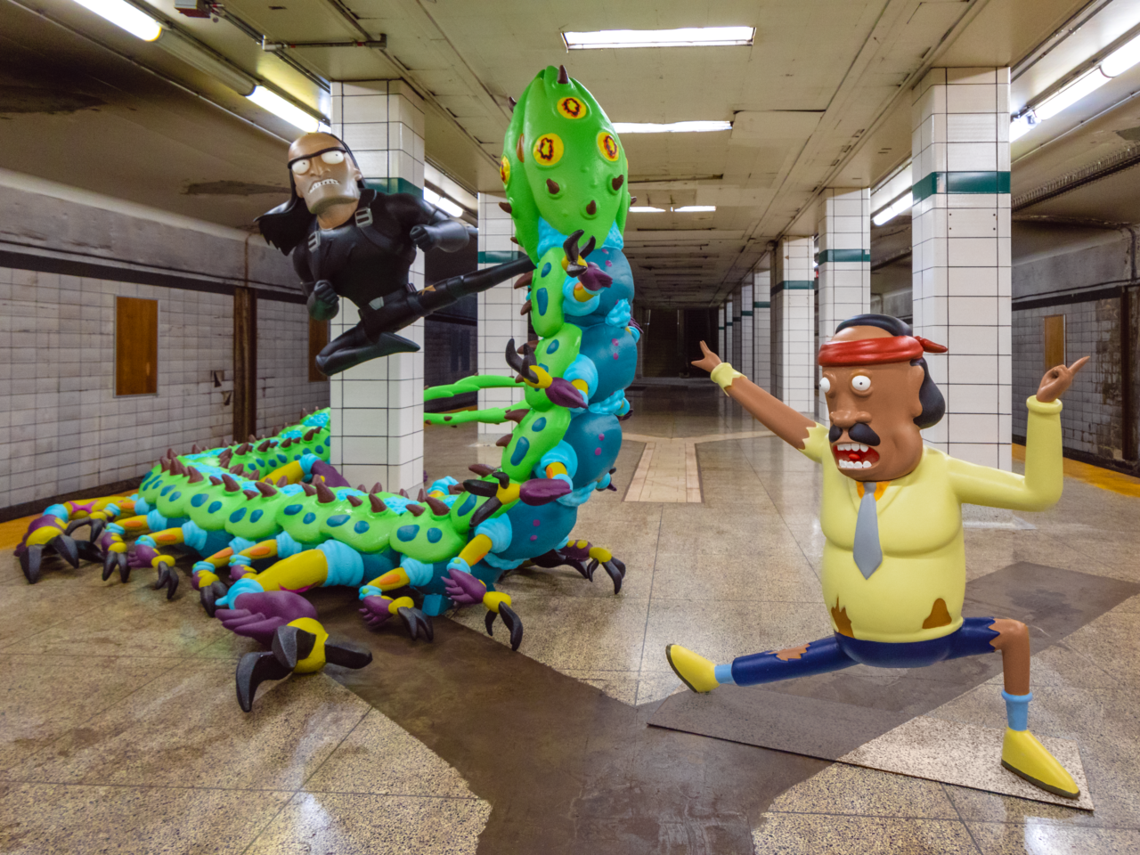 A sculpture of Rick and Morty character Mr. Goldenfold at the Lower Bay Station in Toronto, Canada. The scene is part of the ongoing #WORMAGEDDON fan experience leading to the global release of Adult Swim’s Rick and Morty season six starting September 4, 2022. (Courtesy Adult Swim)